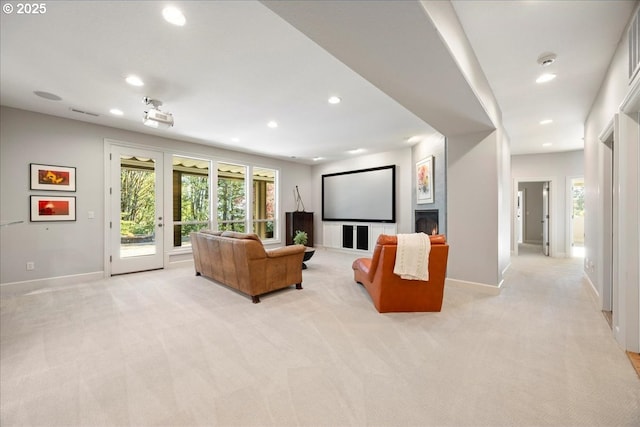 9522 NW Skyview Dr, Portland, OR 97231 - living area with recessed lighting, light carpet, baseboards, and plenty of natural light