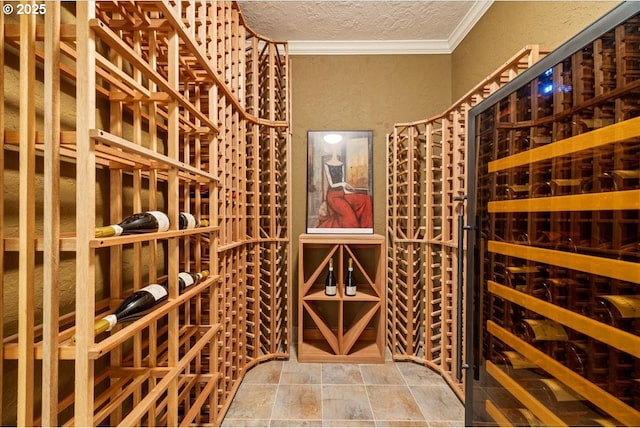 9522 NW Skyview Dr, Portland, OR 97231 - wine area featuring ornamental molding, stone finish flooring, a textured wall, and a textured ceiling