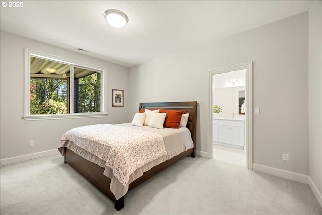 9522 NW Skyview Dr, Portland, OR 97231 - bedroom with carpet flooring, baseboards, and ensuite bathroom
