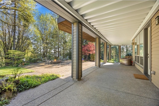 view of patio with a fire pit