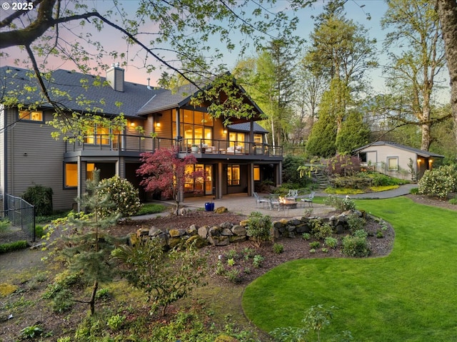 9522 NW Skyview Dr, Portland, OR 97231 - rear view of property with a fire pit, a patio, a deck, a chimney, and a shingled roof
