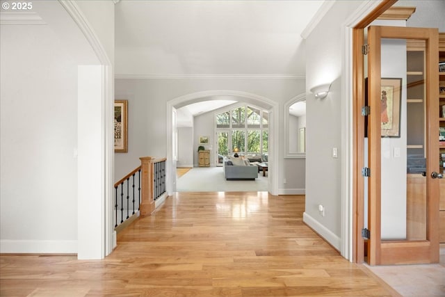 9522 NW Skyview Dr, Portland, OR 97231 - corridor featuring arched walkways, light wood-type flooring, baseboards, and crown molding