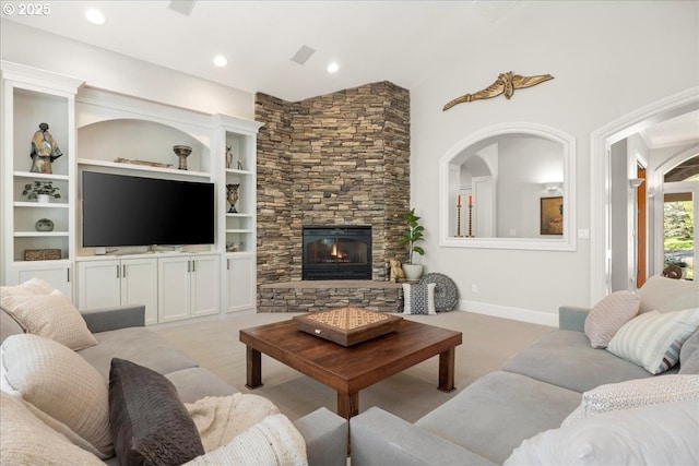 9522 NW Skyview Dr, Portland, OR 97231 - living room featuring a stone fireplace, light colored carpet, recessed lighting, and baseboards