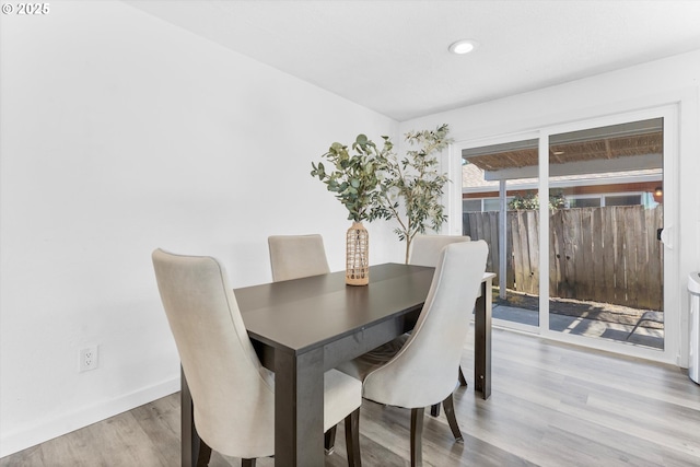 dining area with recessed lighting, baseboards, and wood finished floors