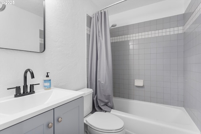 full bath with a textured wall, shower / bathtub combination with curtain, toilet, a textured ceiling, and vanity