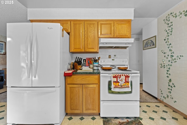 231 NE Chestnut Ave, Myrtle Creek, OR 97457 - kitchen featuring white appliances, under cabinet range hood, brown cabinetry, and decorative backsplash