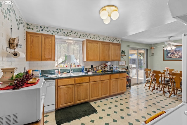 231 NE Chestnut Ave, Myrtle Creek, OR 97457 - kitchen with a sink, light floors, dishwasher, and tasteful backsplash