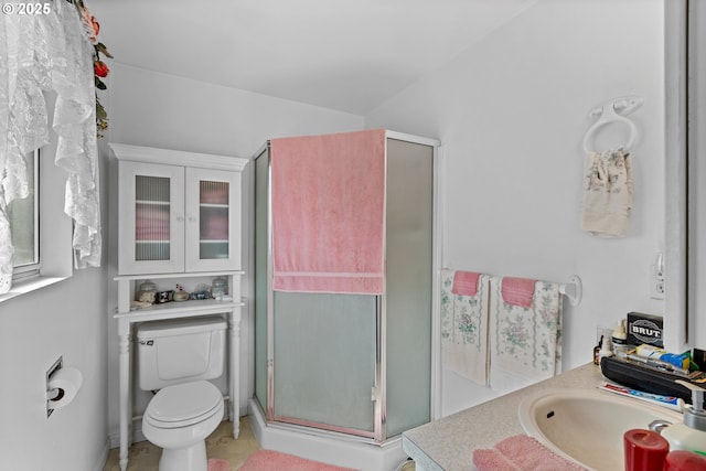 231 NE Chestnut Ave, Myrtle Creek, OR 97457 - bathroom featuring a stall shower, toilet, and vanity