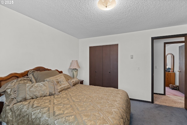 231 NE Chestnut Ave, Myrtle Creek, OR 97457 - bedroom featuring carpet, a closet, a textured ceiling, and baseboards