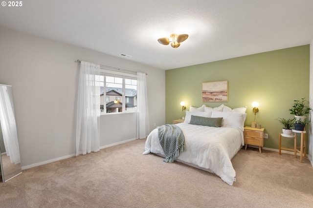 bedroom featuring visible vents, carpet flooring, and baseboards