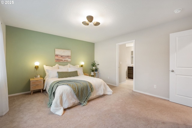 carpeted bedroom featuring baseboards