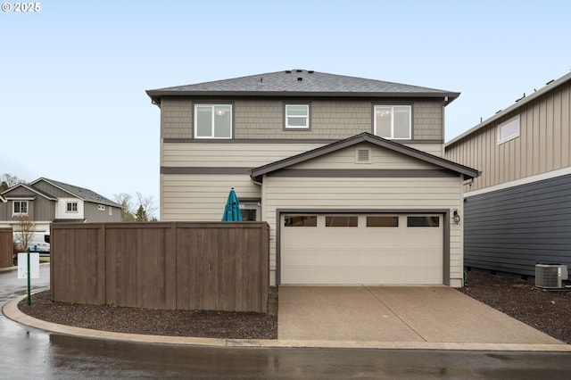 exterior space featuring a shingled roof, fence, cooling unit, driveway, and an attached garage