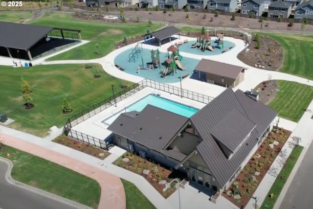 birds eye view of property with a residential view