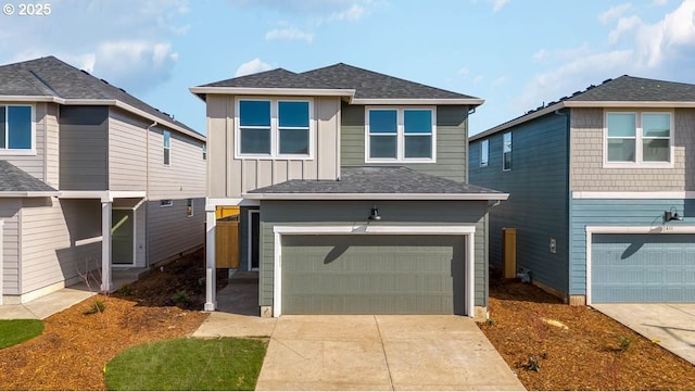 traditional home with a garage, concrete driveway, board and batten siding, and a shingled roof