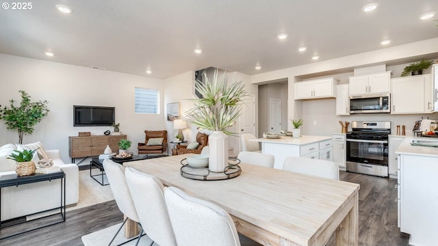 dining room featuring dark wood-style flooring and recessed lighting