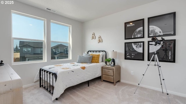bedroom featuring carpet and baseboards
