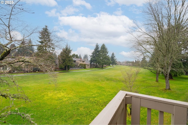 view of yard featuring a balcony