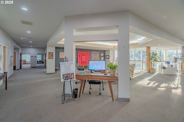 carpeted home office featuring visible vents, recessed lighting, a raised ceiling, and baseboards