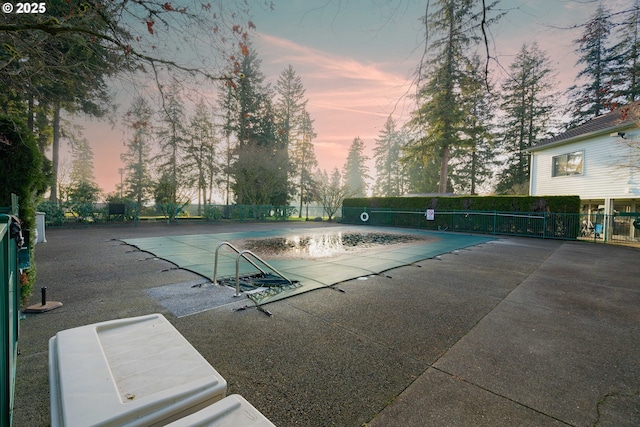 community pool featuring a patio and fence