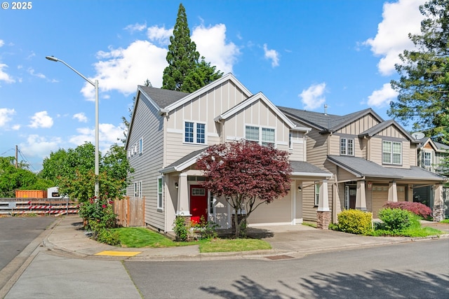 4345 SW Vino Pl, Beaverton, OR 97078 - view of front of home with board and batten siding, concrete driveway, and an attached garage