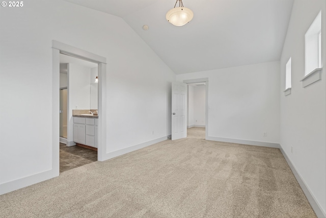 4345 SW Vino Pl, Beaverton, OR 97078 - unfurnished bedroom featuring carpet floors, lofted ceiling, a sink, baseboards, and ensuite bathroom