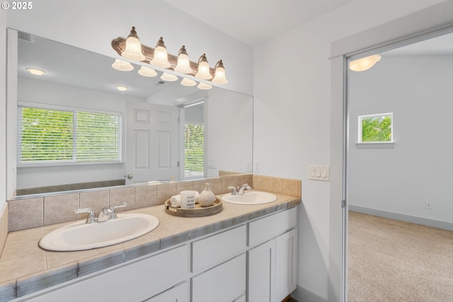 4345 SW Vino Pl, Beaverton, OR 97078 - full bathroom featuring double vanity, healthy amount of natural light, and baseboards