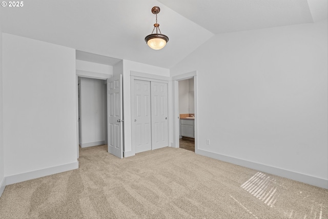 4345 SW Vino Pl, Beaverton, OR 97078 - unfurnished bedroom featuring carpet, lofted ceiling, a closet, baseboards, and connected bathroom