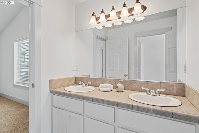 4345 SW Vino Pl, Beaverton, OR 97078 - full bathroom featuring double vanity, baseboards, and lofted ceiling