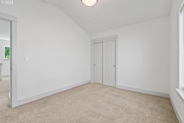 4345 SW Vino Pl, Beaverton, OR 97078 - unfurnished bedroom with carpet floors, vaulted ceiling, a closet, and baseboards