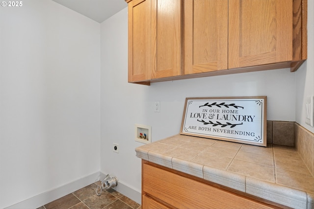 4345 SW Vino Pl, Beaverton, OR 97078 - laundry area with electric dryer hookup, washer hookup, cabinet space, and baseboards