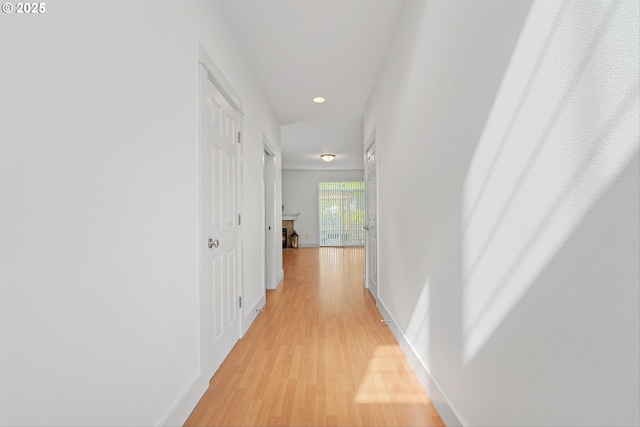 4345 SW Vino Pl, Beaverton, OR 97078 - hallway featuring light wood-type flooring, recessed lighting, and baseboards
