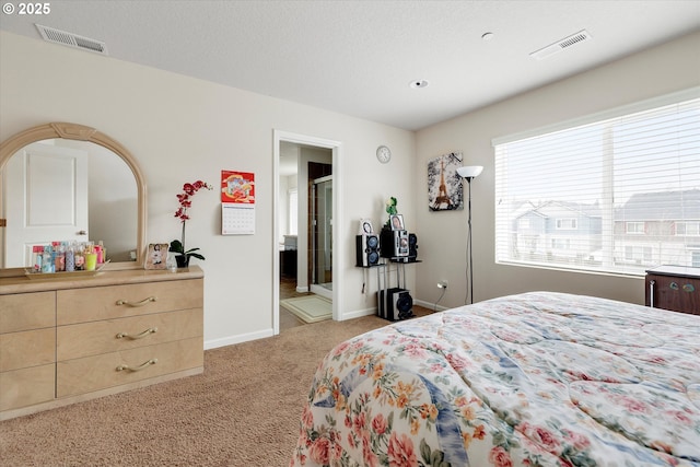 bedroom featuring light carpet and a textured ceiling