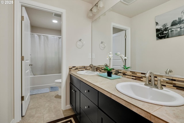 full bathroom featuring toilet, vanity, shower / bath combination with curtain, and decorative backsplash