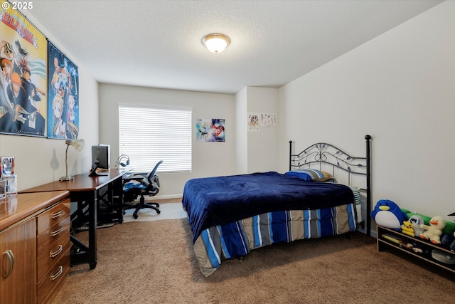 bedroom with a textured ceiling and carpet