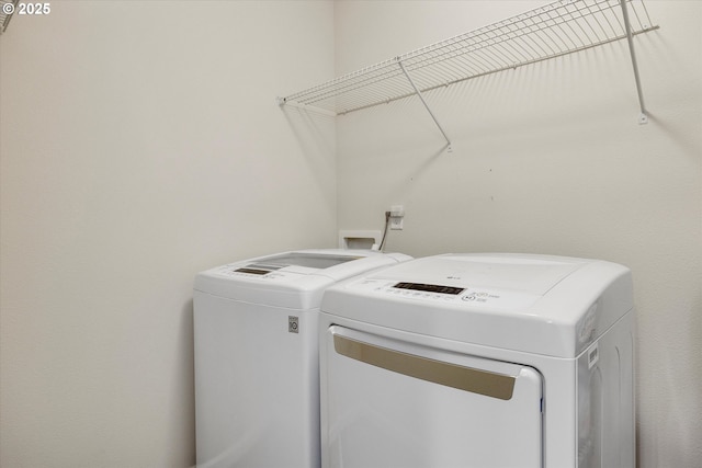 laundry area featuring washing machine and dryer