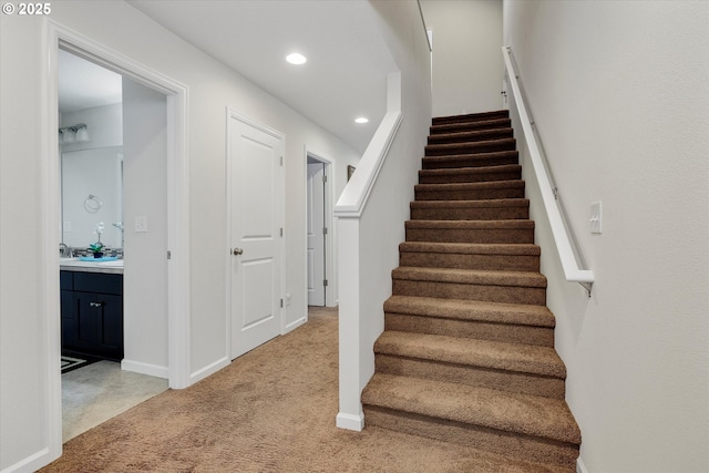 staircase with carpet flooring