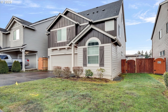 view of front of house featuring a garage and a front yard