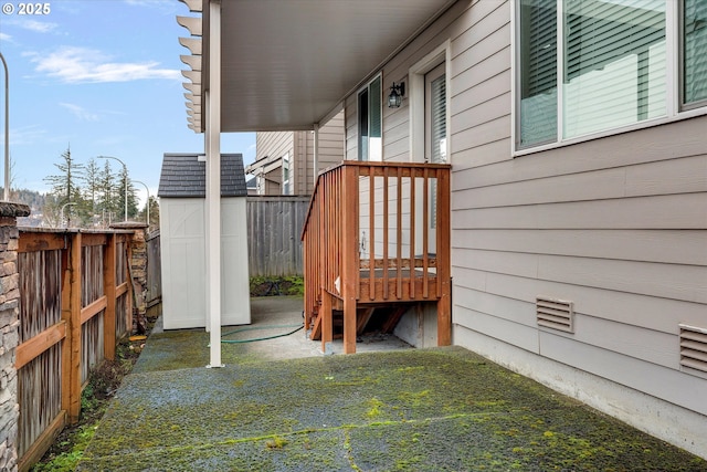 deck featuring a storage shed