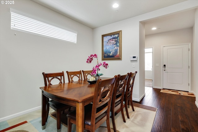 dining area with wood-type flooring