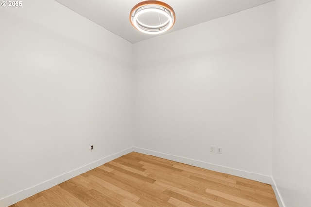922 NW 11th Ave Unit 209, Portland, OR 97209 - spare room featuring baseboards and light wood-style flooring