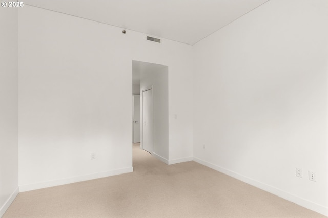 922 NW 11th Ave Unit 209, Portland, OR 97209 - spare room featuring light carpet and baseboards