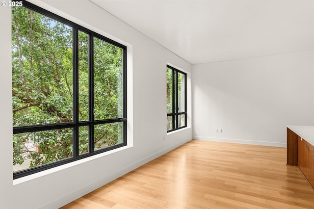 922 NW 11th Ave Unit 209, Portland, OR 97209 - empty room featuring light wood-style floors and baseboards