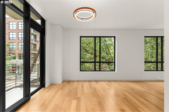 922 NW 11th Ave Unit 209, Portland, OR 97209 - empty room with wood finished floors and baseboards