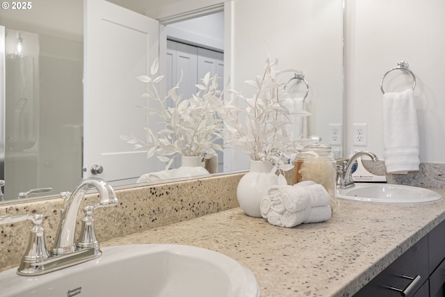 bathroom with double vanity and a sink