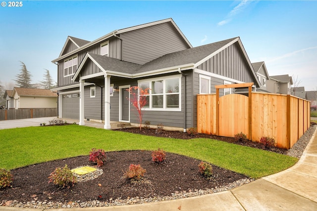 view of front of property with fence, a front lawn, and board and batten siding