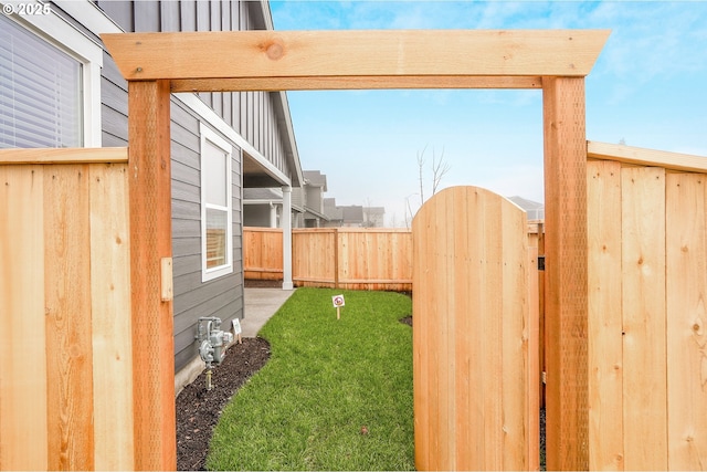 view of yard featuring a gate and fence