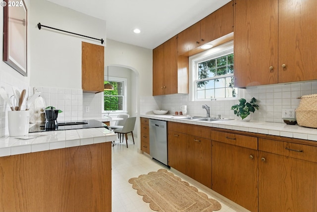 368 NW Lomita Ter, Portland, OR 97210 - kitchen with dishwasher, light floors, backsplash, and recessed lighting