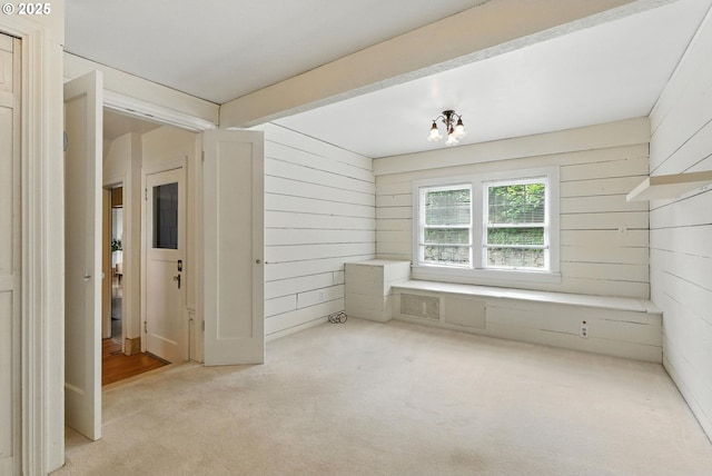 368 NW Lomita Ter, Portland, OR 97210 - spare room with wooden walls and light carpet