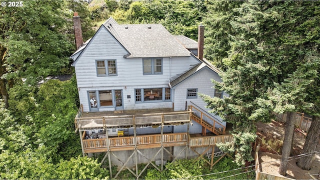 368 NW Lomita Ter, Portland, OR 97210 - back of property featuring a chimney, a wooden deck, and a shingled roof