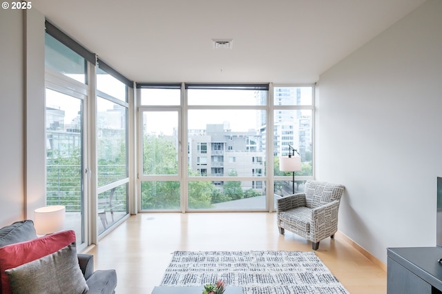 1255 NW 9th Ave Unit 508, Portland, OR 97209 - sunroom with a wall of windows, healthy amount of natural light, wood finished floors, and a view of city